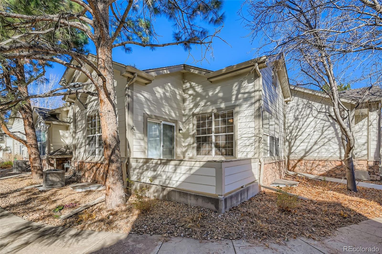 208 Remuda Lane Lafayette, CO 80026 - Photo 23 of 28 a view of a chairs and table in the backyard