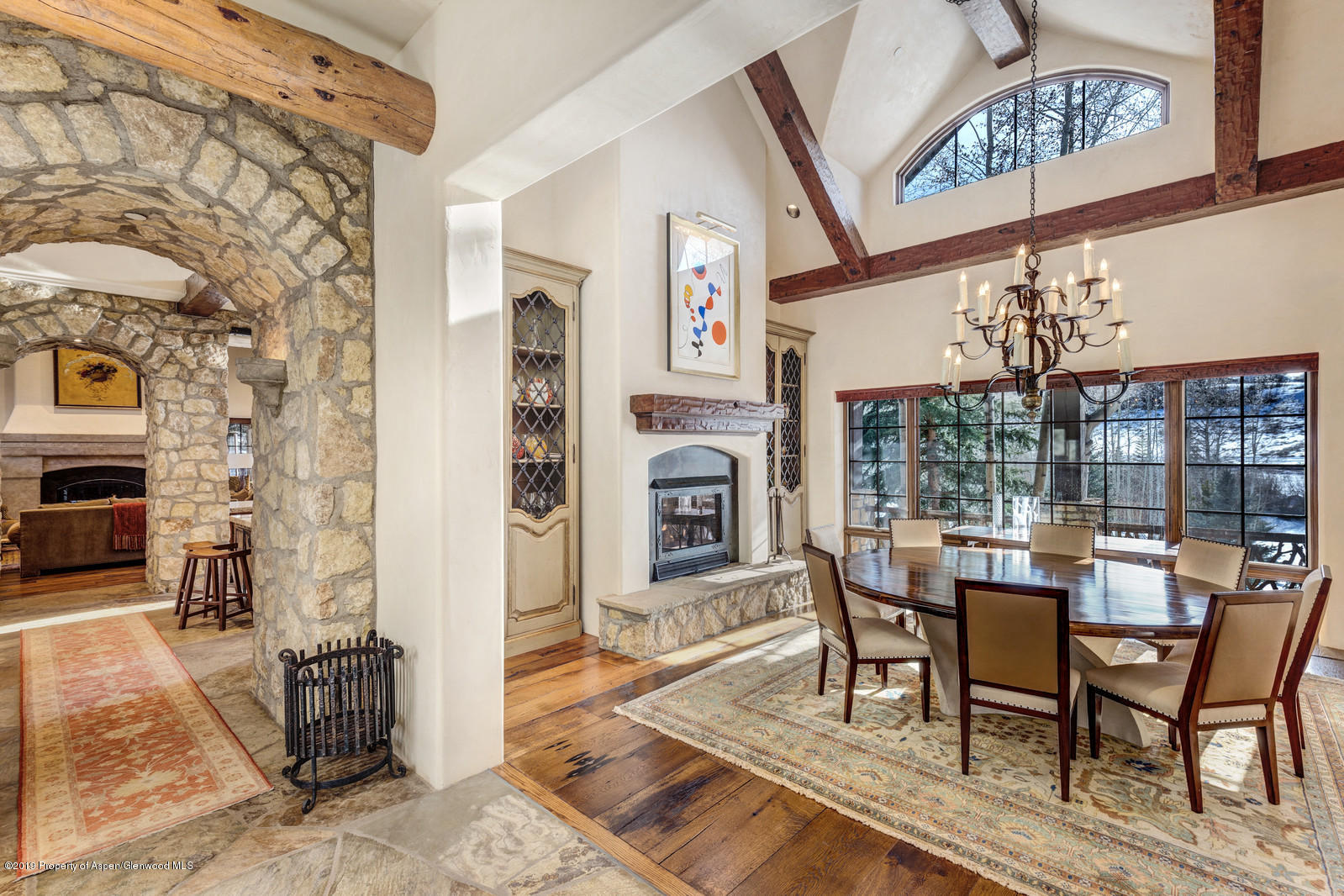 124 Cold Stream Lane Aspen, CO 81611 - Photo 11 of 38 a view of a dining room with furniture window and wooden floor