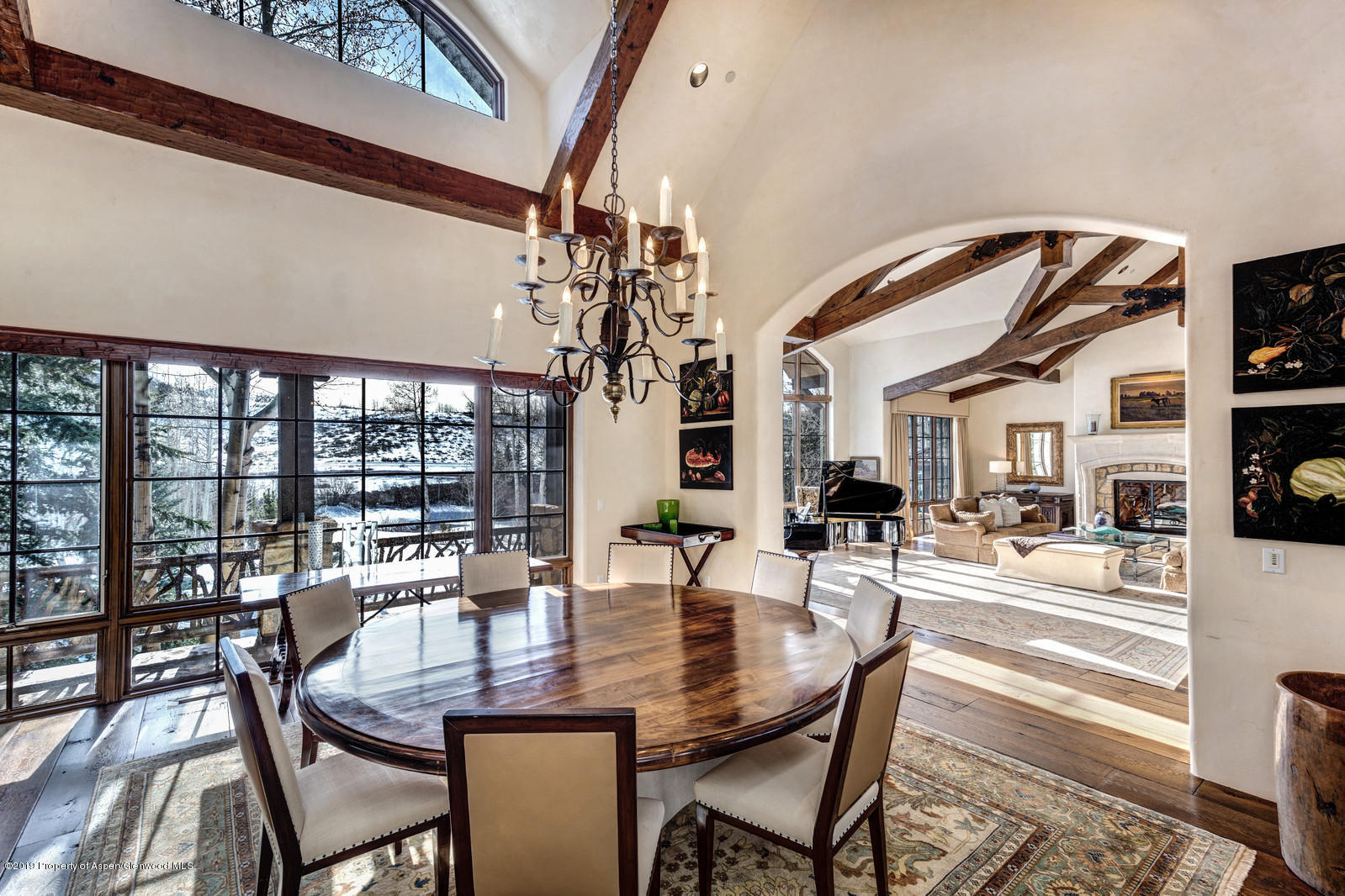 124 Cold Stream Lane Aspen, CO 81611 - Photo 12 of 38 a dining room with furniture a chandelier and wooden floor