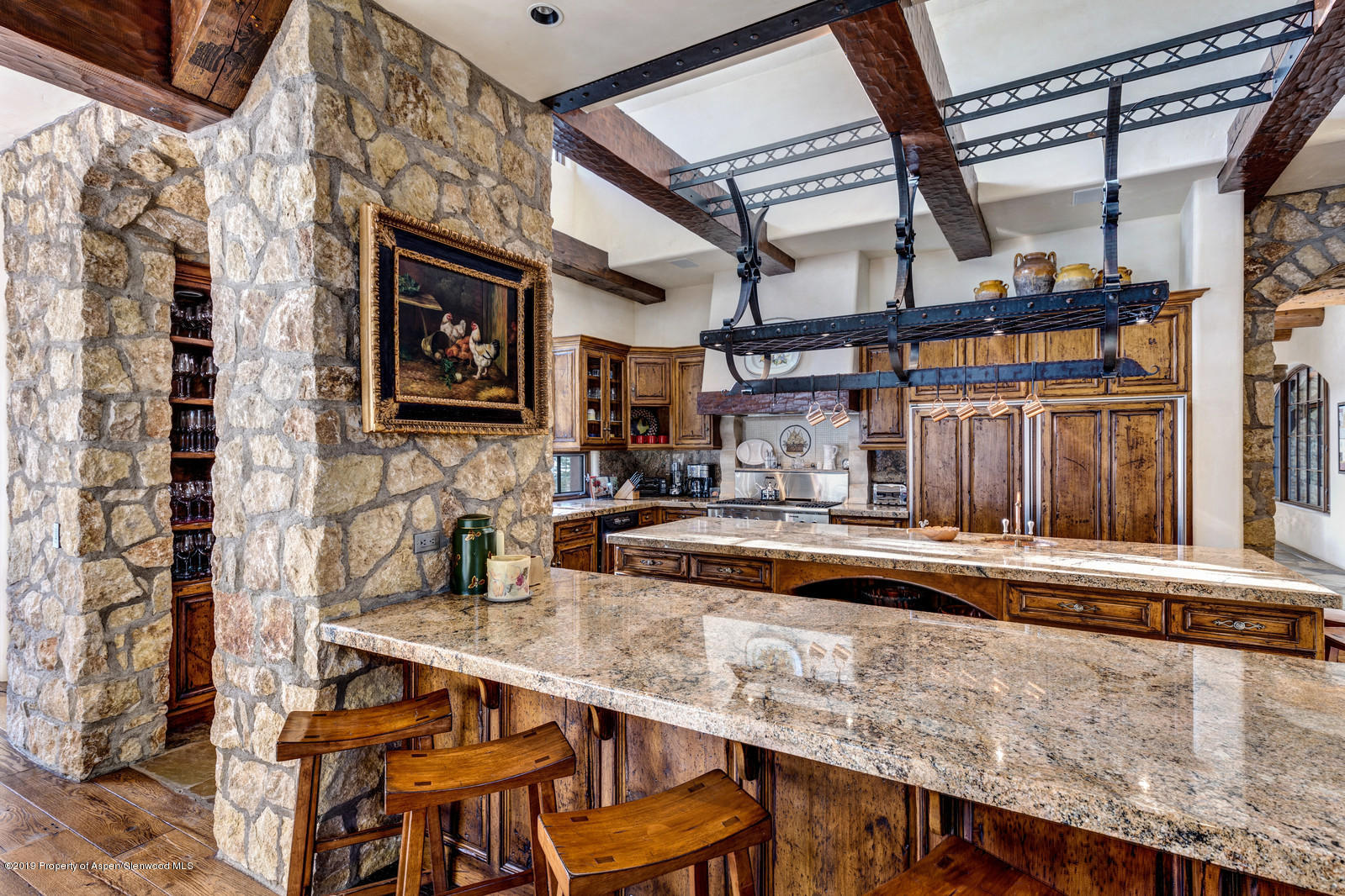 124 Cold Stream Lane Aspen, CO 81611 - Photo 15 of 38 a kitchen with a table and chairs