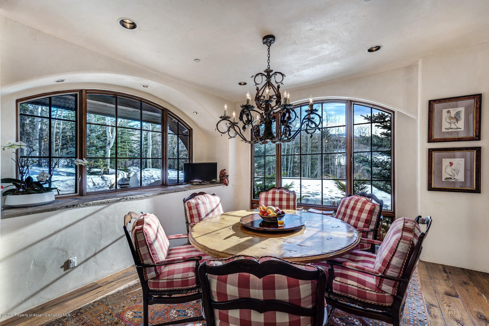 124 Cold Stream Lane Aspen, CO 81611 - Photo 18 of 38 a dining room with furniture a chandelier and wooden floor