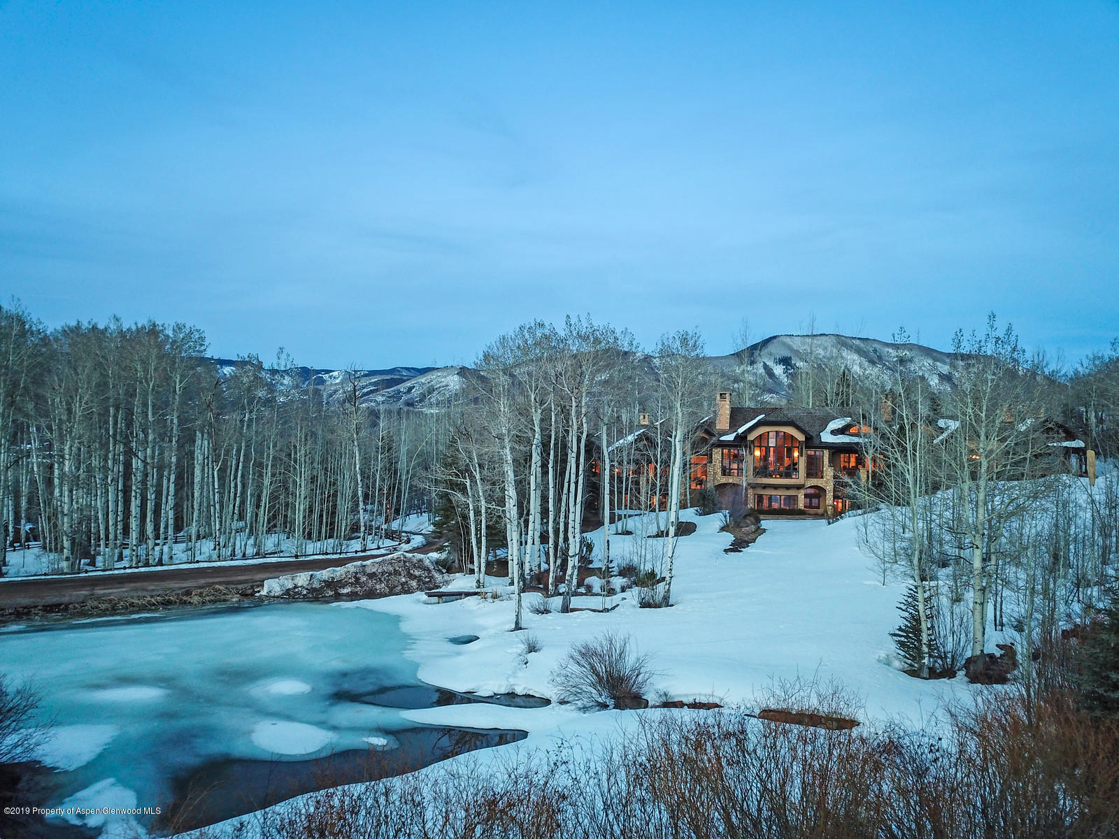 124 Cold Stream Lane Aspen, CO 81611 - Photo 2 of 38 a view of a house with a yard