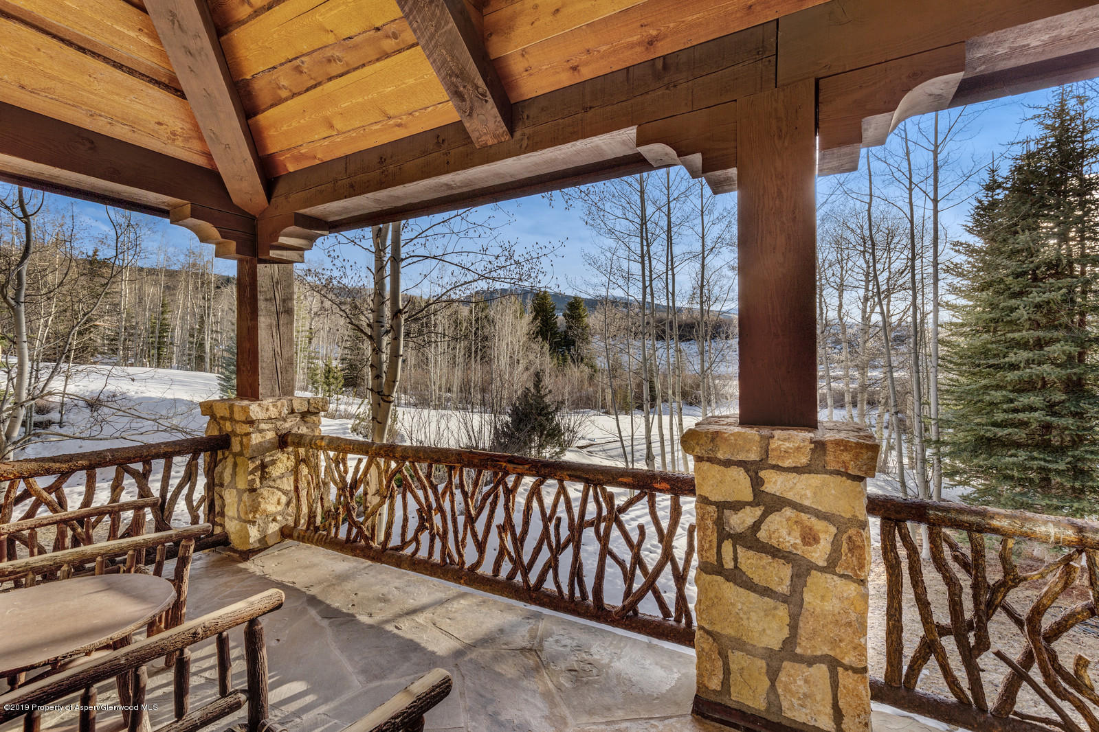 124 Cold Stream Lane Aspen, CO 81611 - Photo 24 of 38 a view of a two chairs with the couches under an umbrella