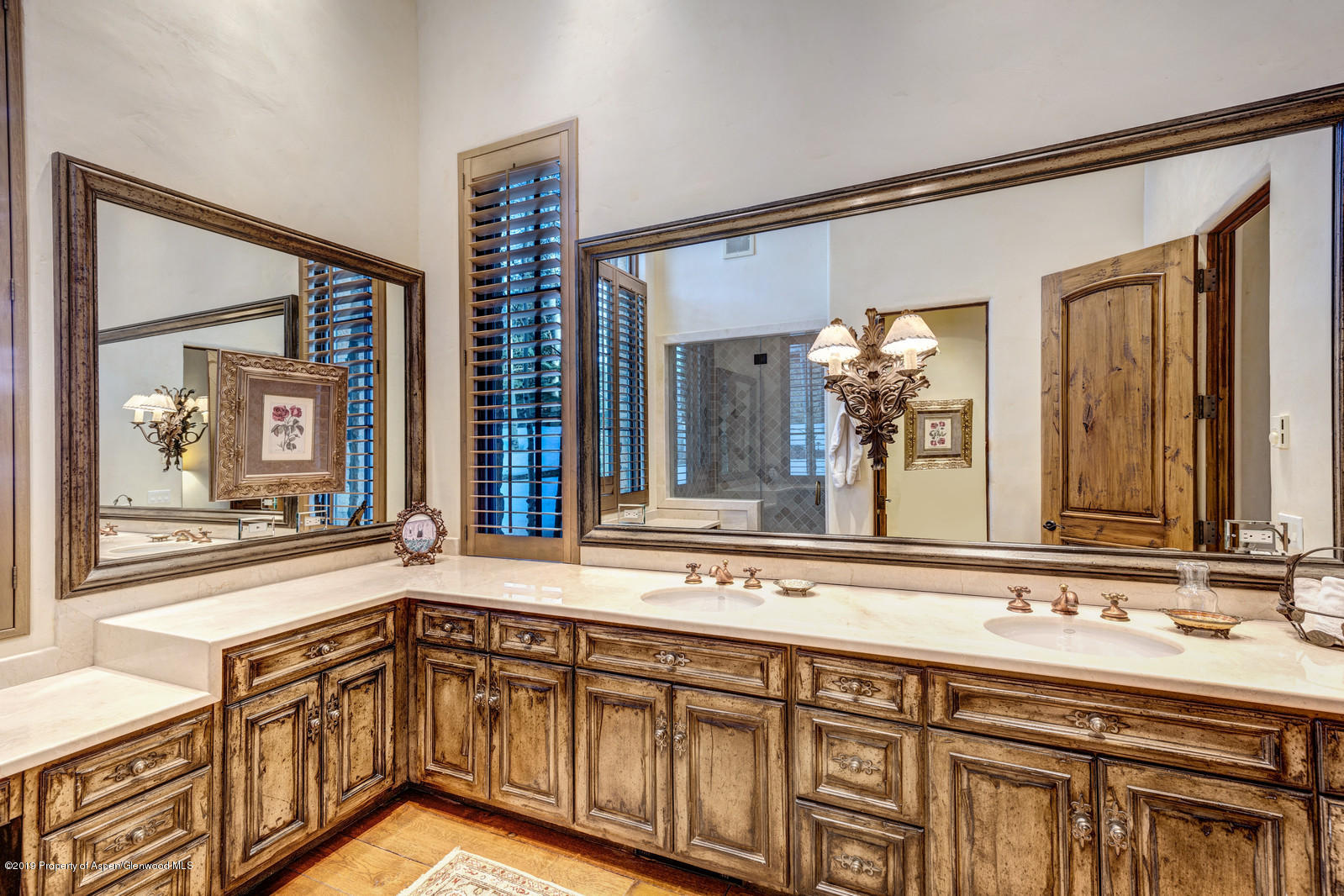 124 Cold Stream Lane Aspen, CO 81611 - Photo 27 of 38 a bathroom with a sink and a large mirror