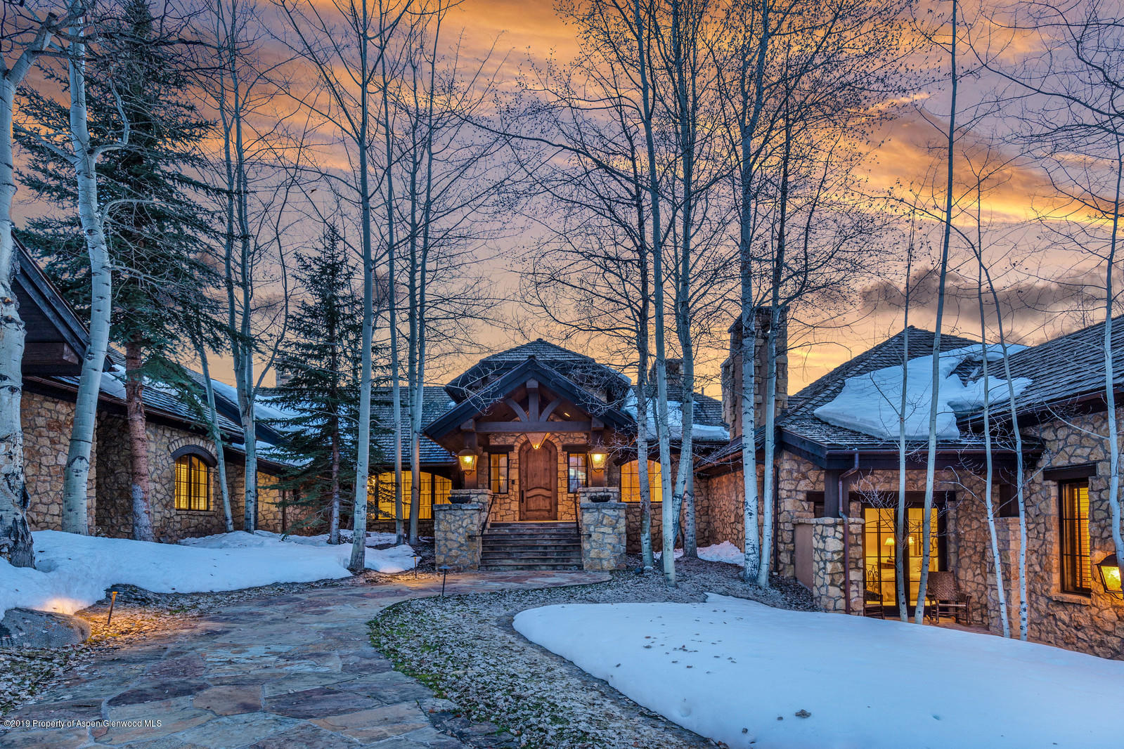 124 Cold Stream Lane Aspen, CO 81611 - Photo 3 of 38 a view of a house with a patio covered with snow