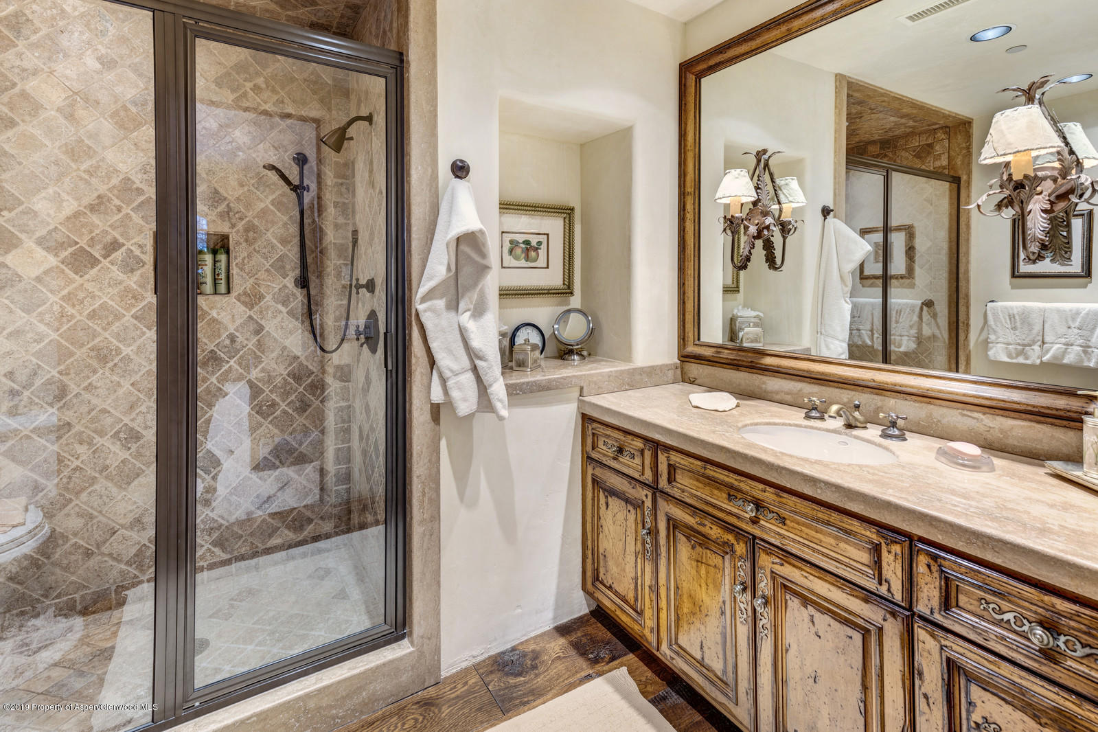 124 Cold Stream Lane Aspen, CO 81611 - Photo 37 of 38 a bathroom with a sink a mirror and a shower