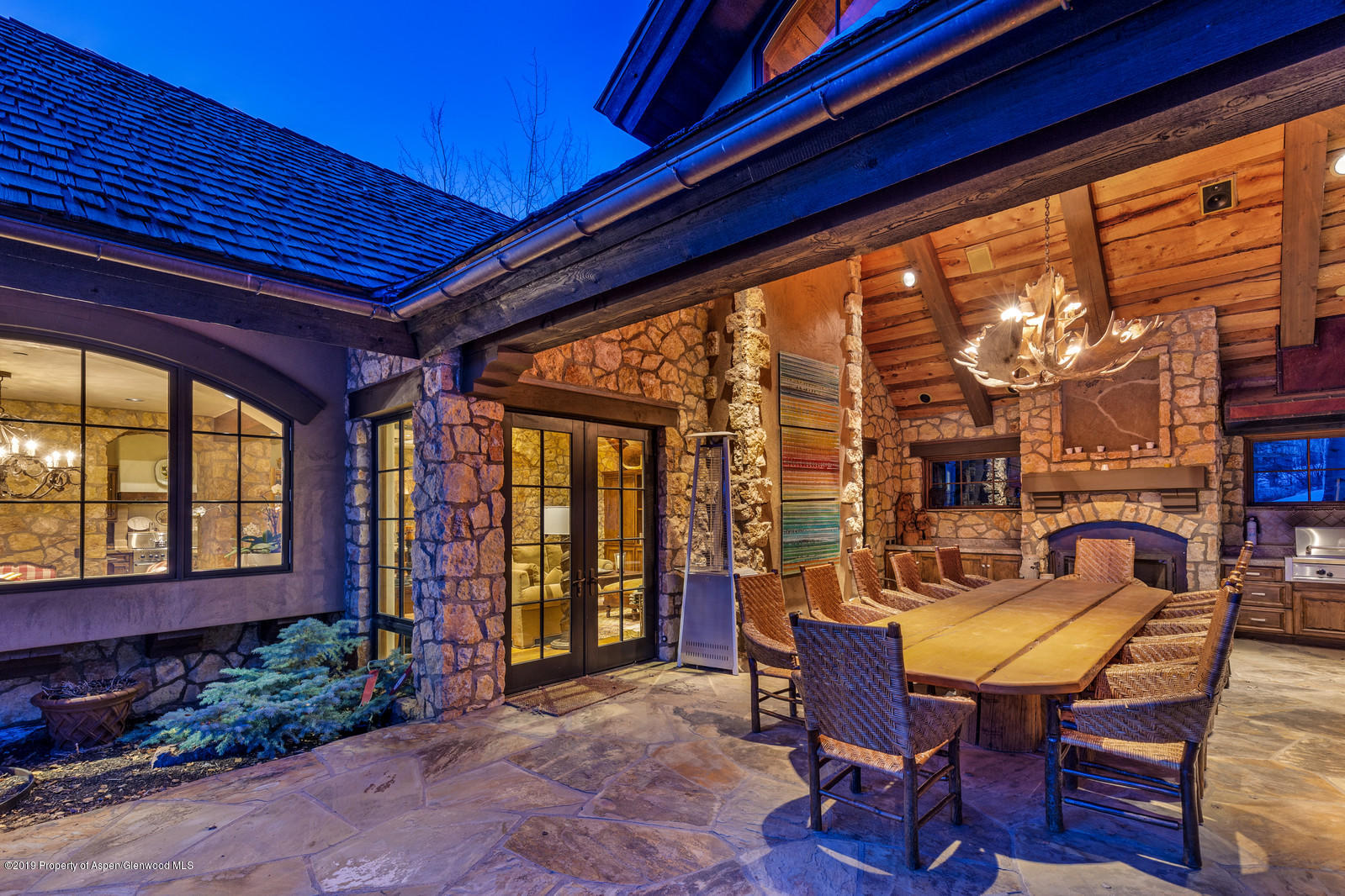 124 Cold Stream Lane Aspen, CO 81611 - Photo 4 of 38 a view of a porch with furniture and a yard