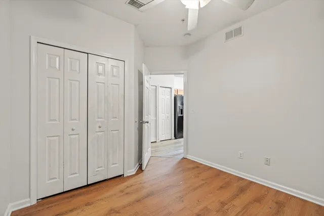 an empty room with wooden floor