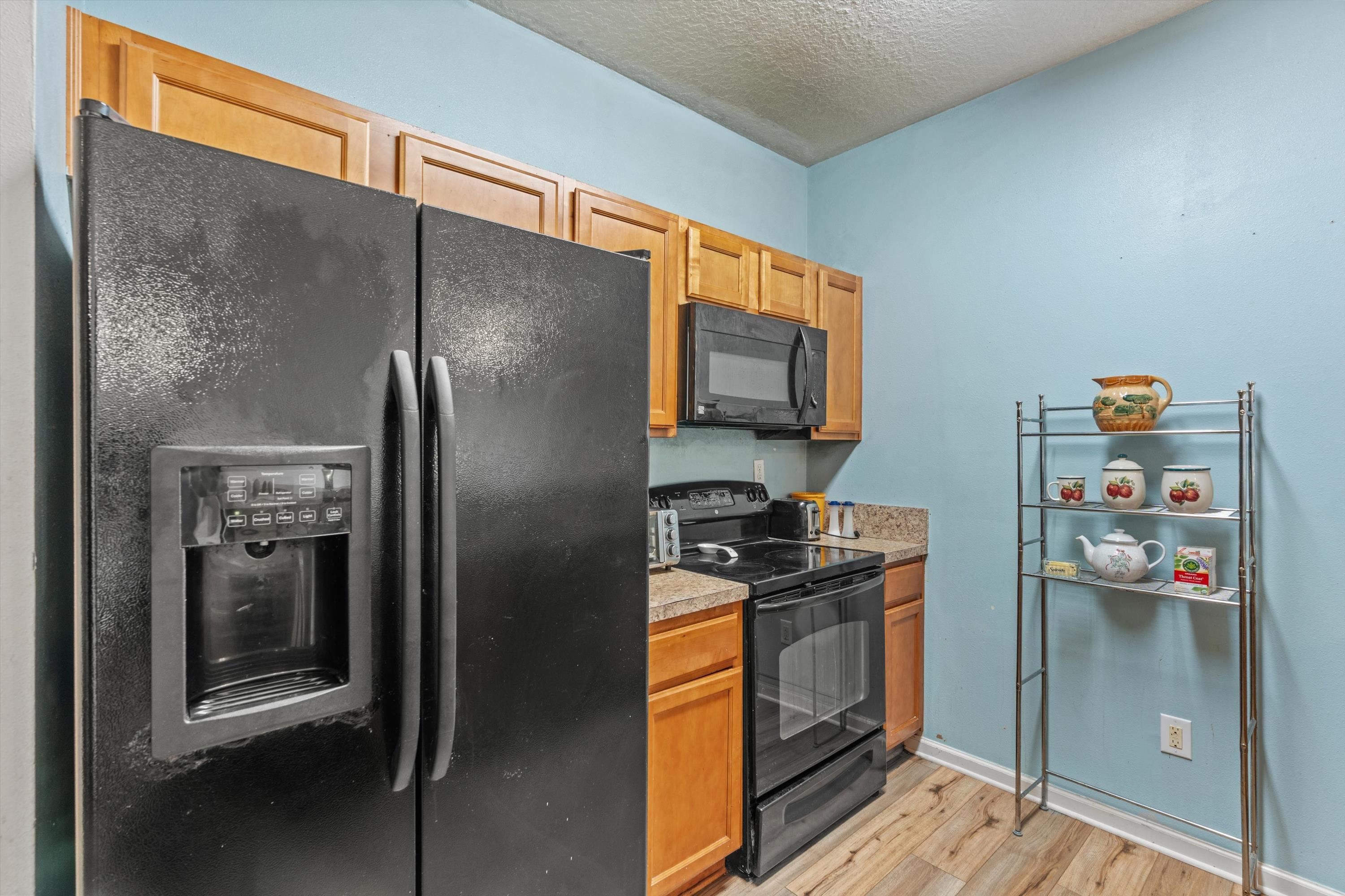 2330 Golden Lake Loop St. Augustine, FL 32084 - Photo 9 of 23 a kitchen with stainless steel appliances granite countertop a refrigerator a stove and a sink