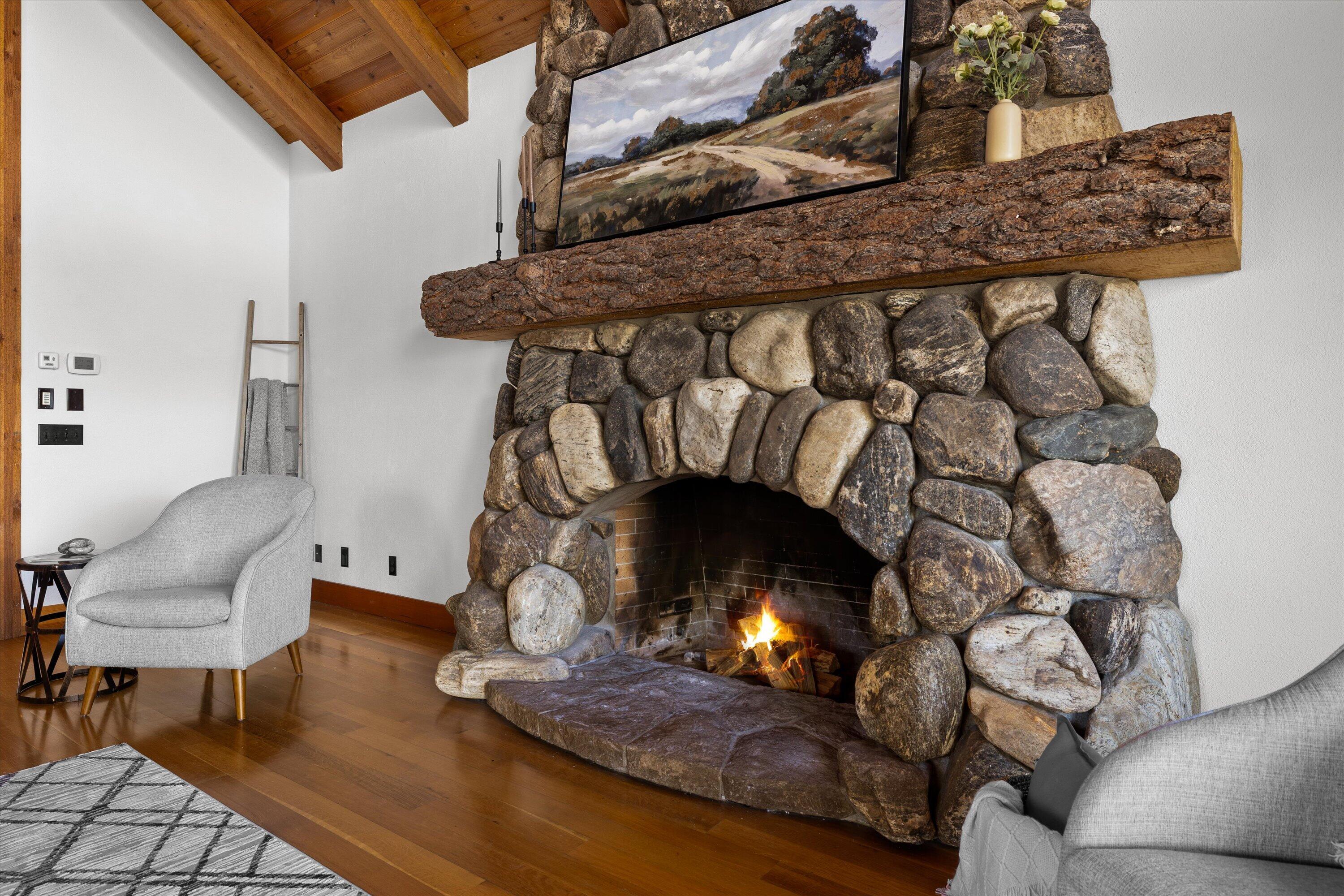 64155 Hunnell Road Bend, OR 97703 - Photo 14 of 96 The statement stone fireplace is a fitting anchor to the Great Room.