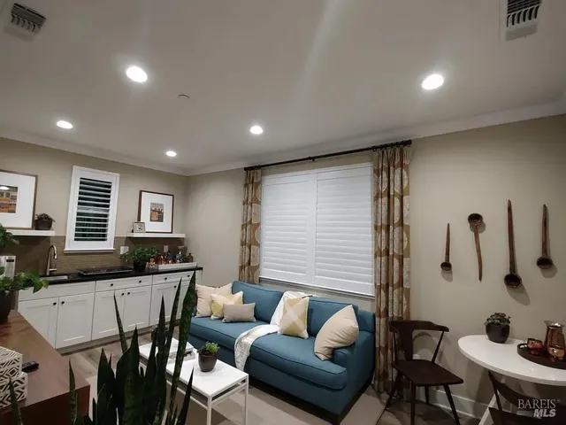 a living room with furniture and a table