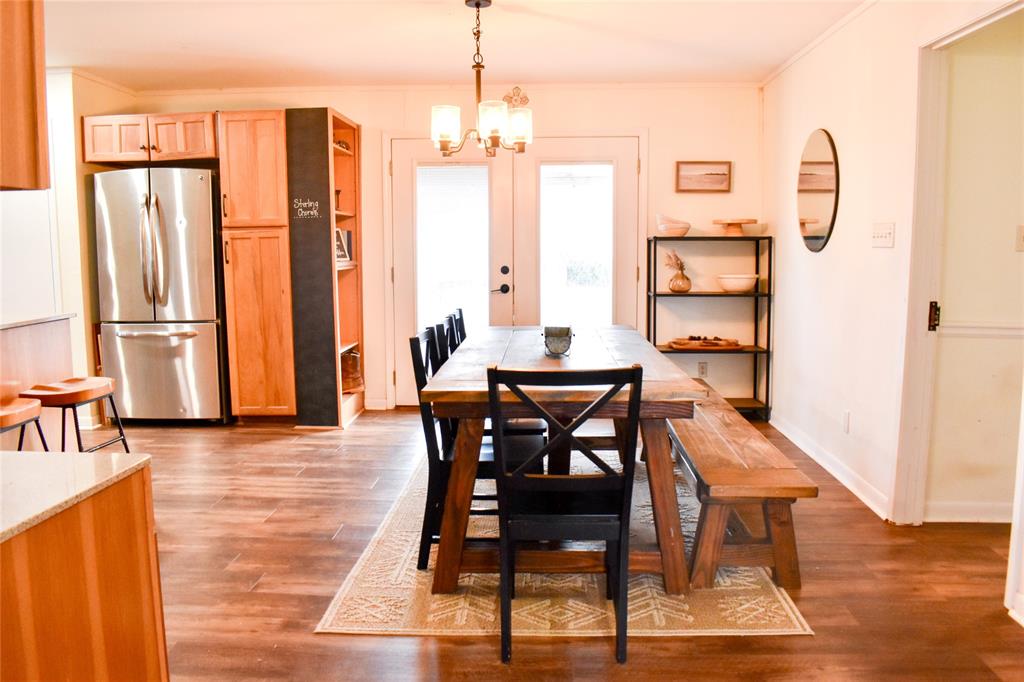 509 County Road 35985 Powderly, TX 75473 - Photo 15 of 37 a view of a a dining room with furniture window and wooden floor