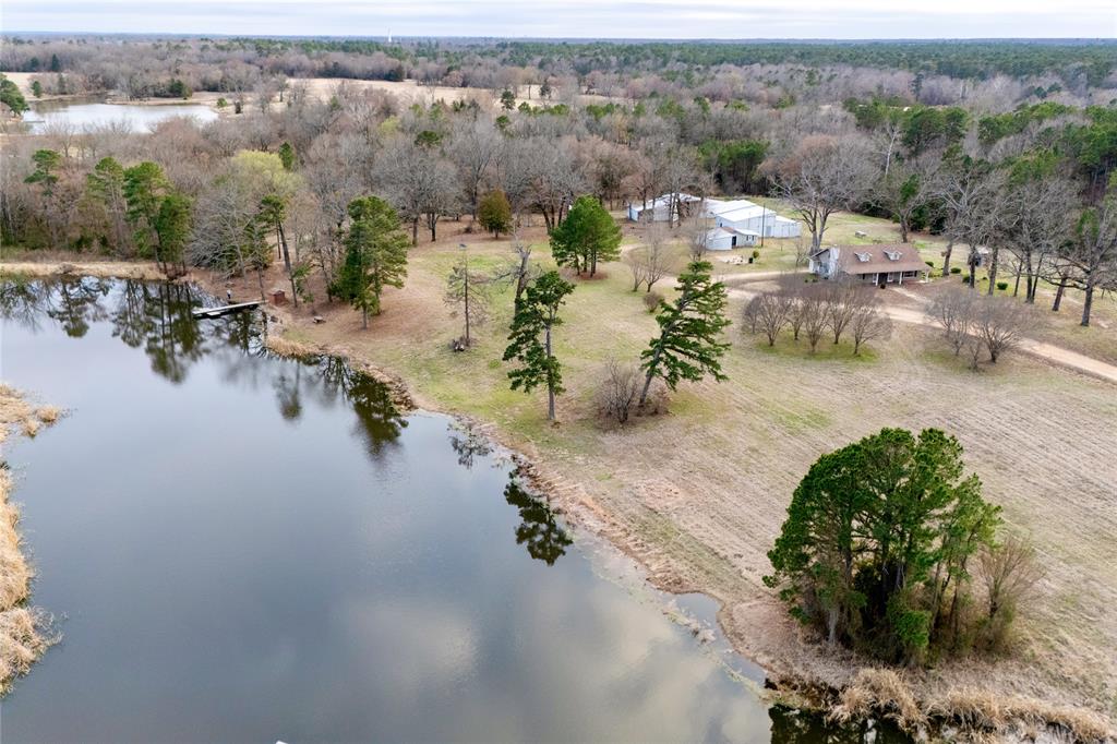 509 County Road 35985 Powderly, TX 75473 - Photo 3 of 37 an aerial view of a house with yard and lake view