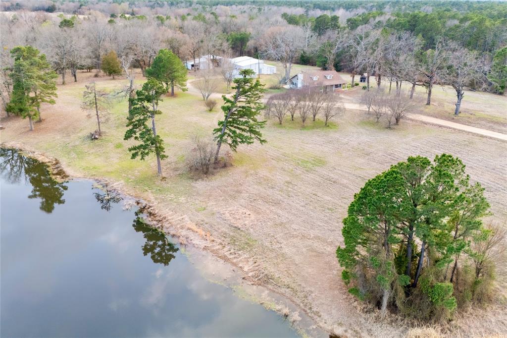 509 County Road 35985 Powderly, TX 75473 - Photo 31 of 37 an aerial view of a house with a yard and lake view