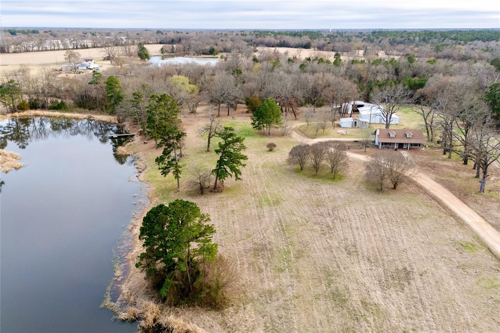 509 County Road 35985 Powderly, TX 75473 - Photo 4 of 37 an aerial view of a house with yard and lake view