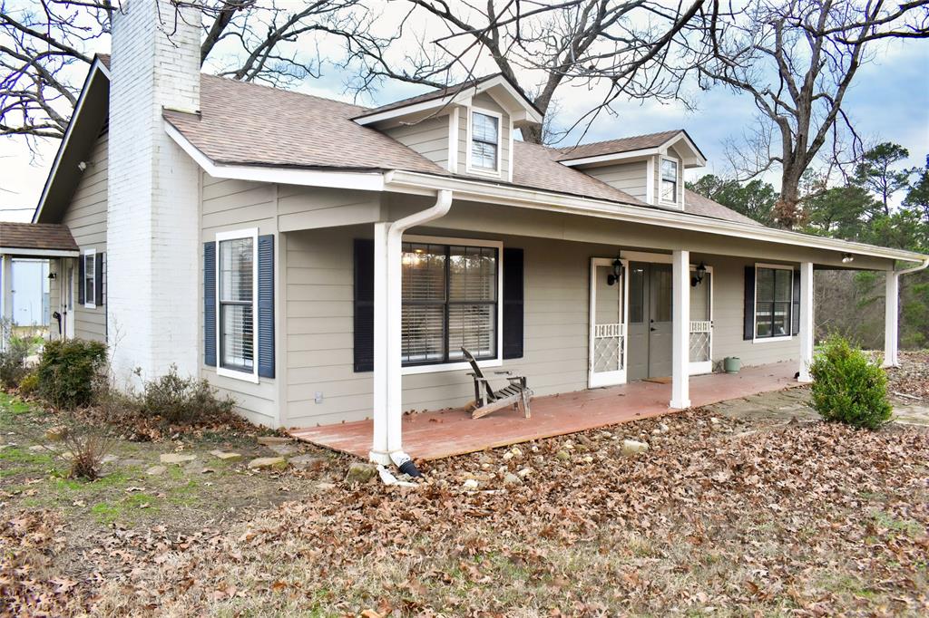 509 County Road 35985 Powderly, TX 75473 - Photo 9 of 37 front view of a house with a porch
