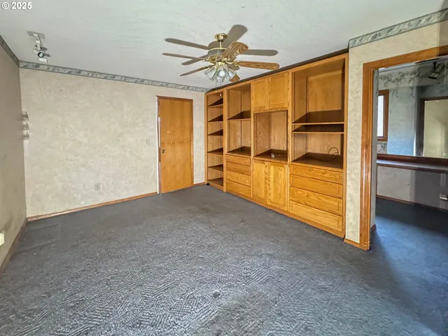 a view of a room with wooden walls