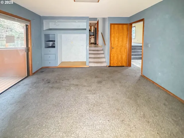 a view of an empty room with a window