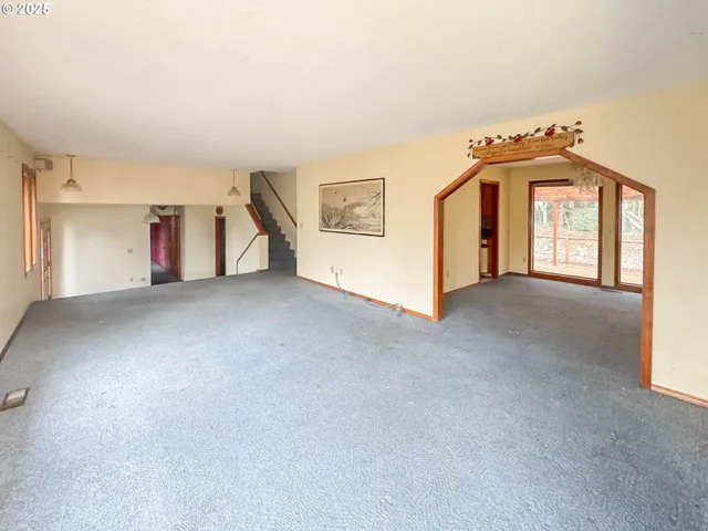 a view of an empty room with windows