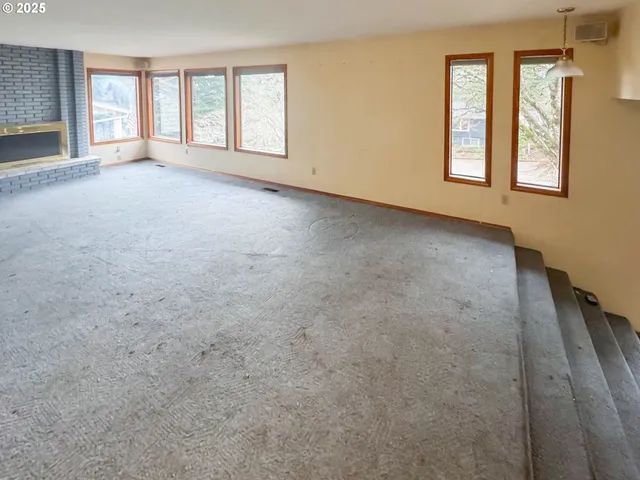 an empty room with windows