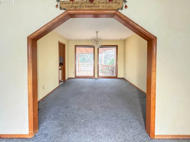 a view of a hallway with a window