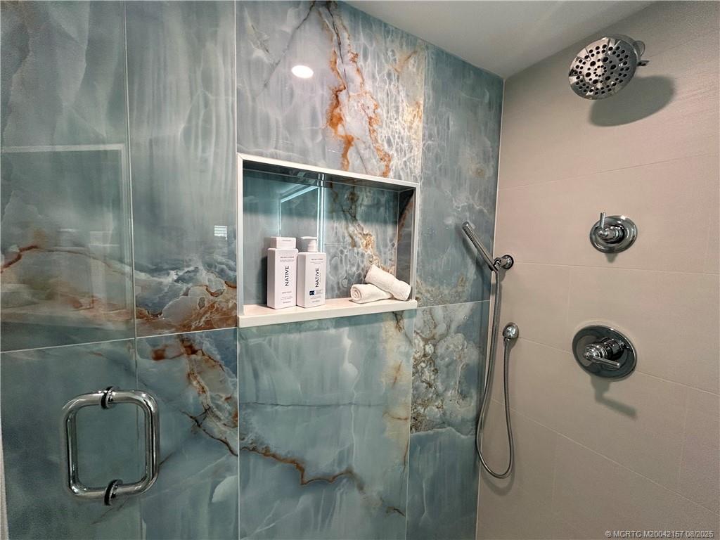 484 Northeast Plantation Road, Unit 4102 Stuart, FL 34996 - Photo 17 of 35 a bathroom with a shower