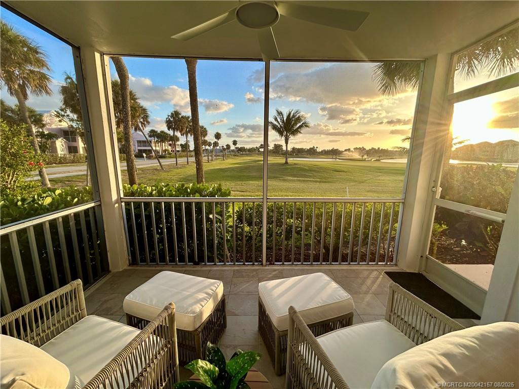 484 Northeast Plantation Road, Unit 4102 Stuart, FL 34996 - Photo 2 of 35 a balcony with furniture and wooden floor