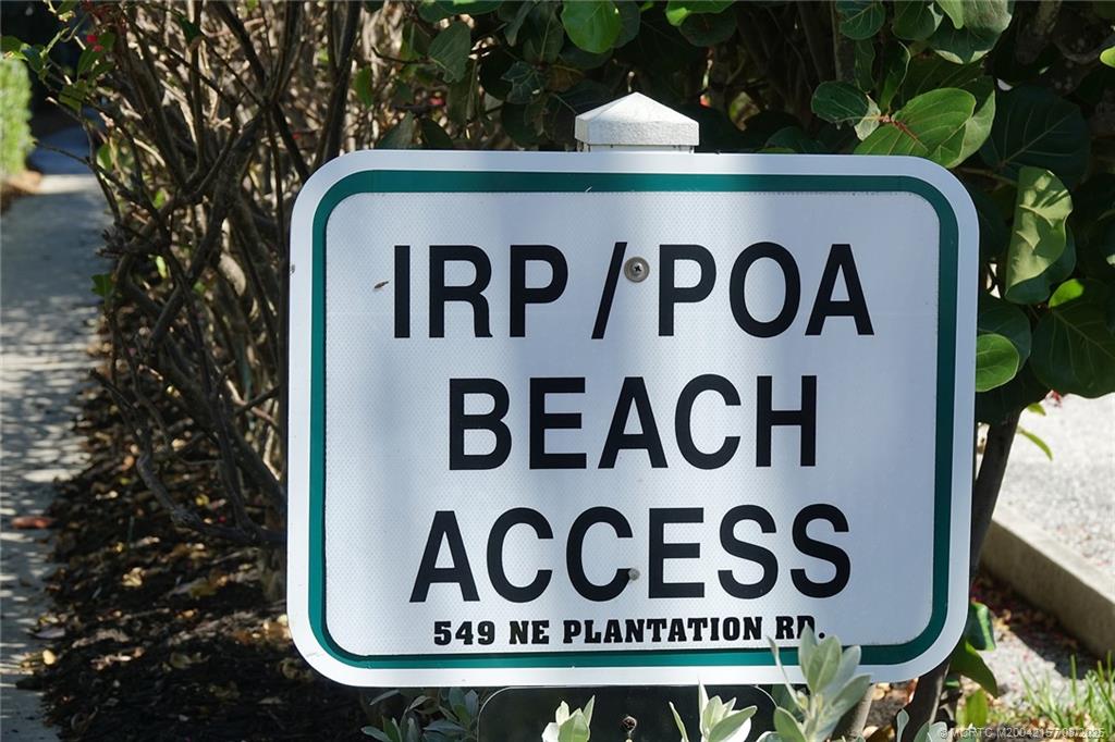 484 Northeast Plantation Road, Unit 4102 Stuart, FL 34996 - Photo 24 of 35 a street sign that is on a pole