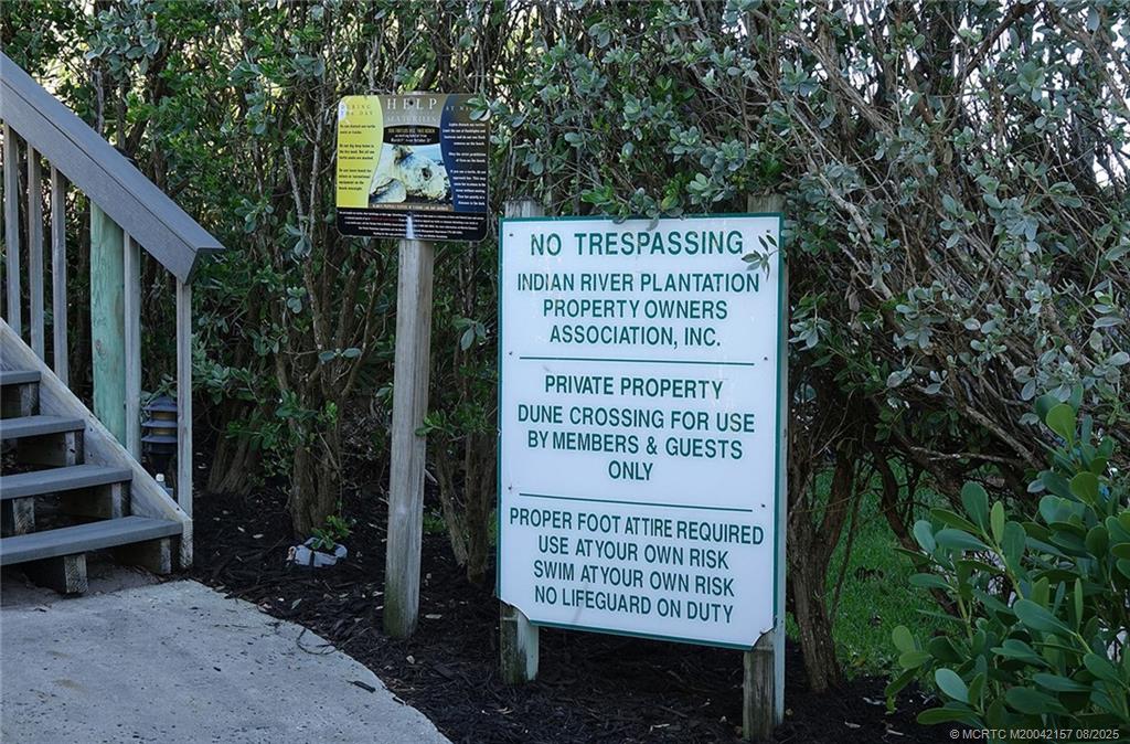 484 Northeast Plantation Road, Unit 4102 Stuart, FL 34996 - Photo 26 of 35 a sign on the side of a building