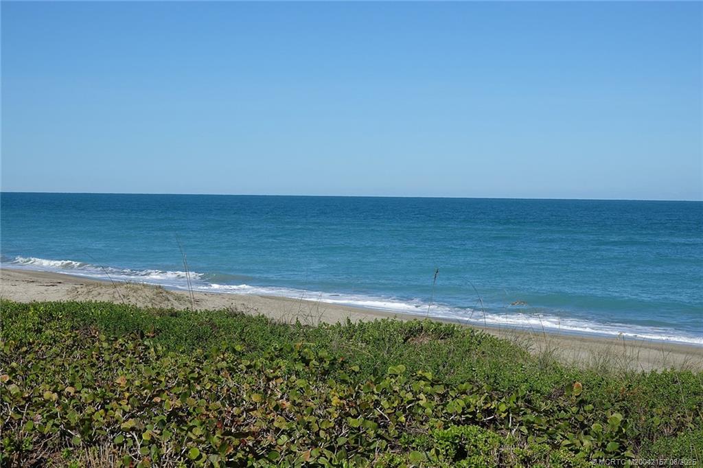 484 Northeast Plantation Road, Unit 4102 Stuart, FL 34996 - Photo 28 of 35 a view of an ocean and beach