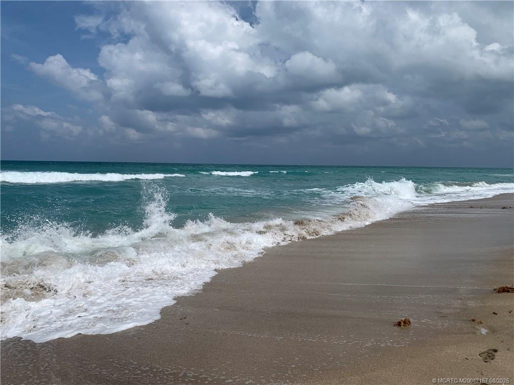 484 Northeast Plantation Road, Unit 4102 Stuart, FL 34996 - Photo 29 of 35 a view of a lake view with a big yard