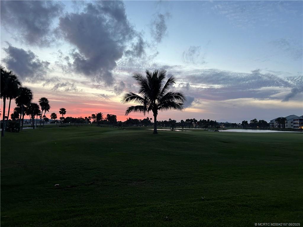 484 Northeast Plantation Road, Unit 4102 Stuart, FL 34996 - Photo 31 of 35 a view of a golf course with a lake