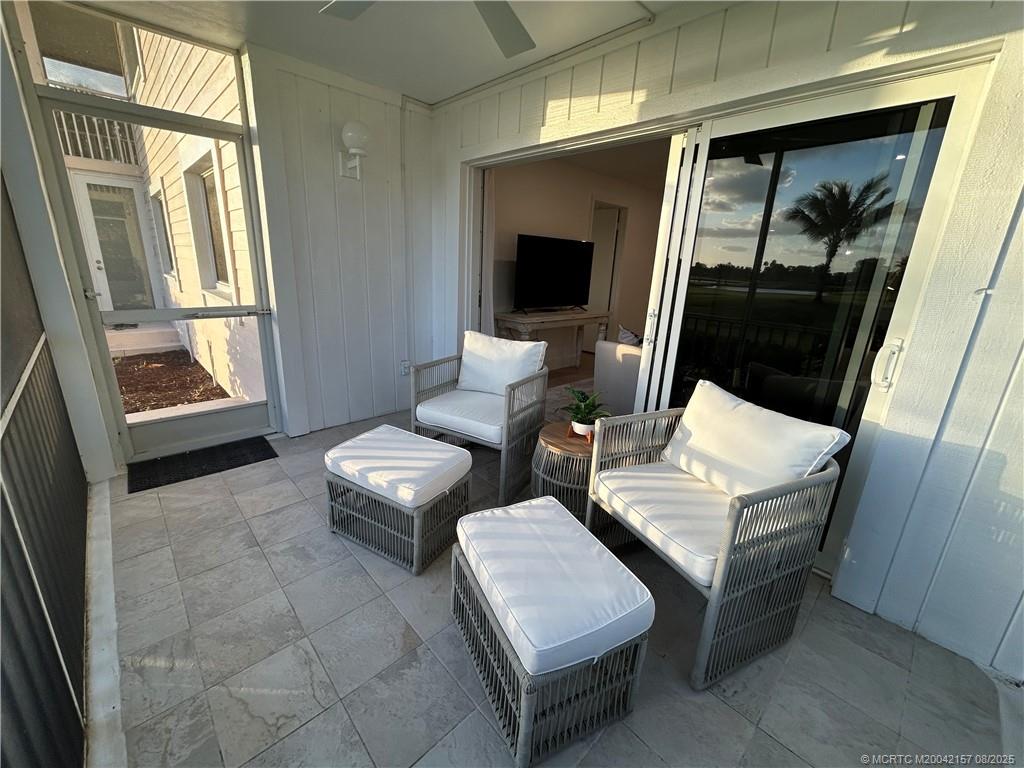484 Northeast Plantation Road, Unit 4102 Stuart, FL 34996 - Photo 5 of 35 a living room with furniture and a window