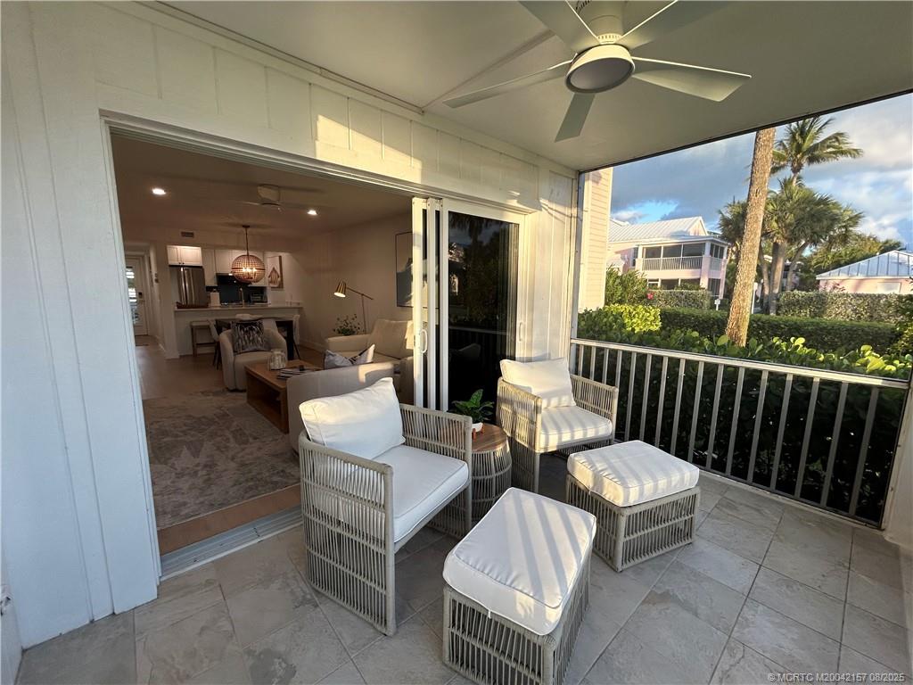 484 Northeast Plantation Road, Unit 4102 Stuart, FL 34996 - Photo 6 of 35 a outdoor living space with patio furniture and a potted plant