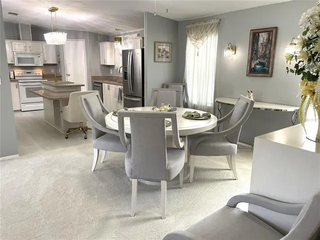 a view of a dining room with furniture