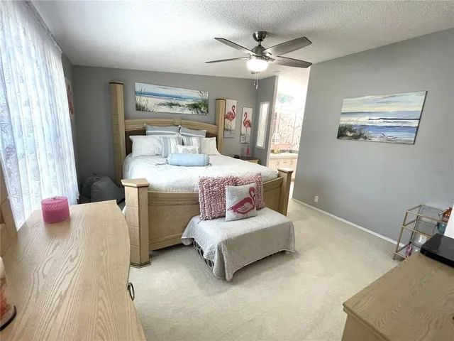 a view of walk in closet with clothes