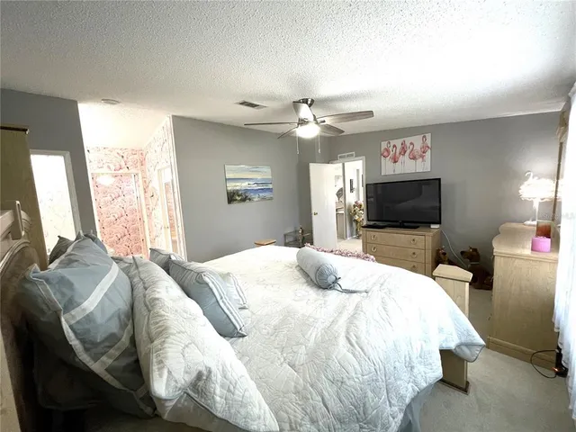 a bathroom with a double vanity sink toilet and shower
