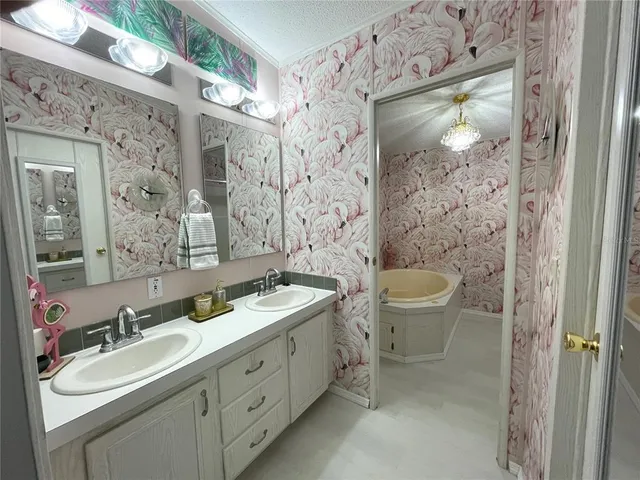 a bathroom with a bathtub and shower