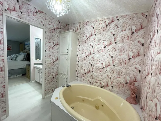 a bathroom with a double vanity sink toilet and a mirror