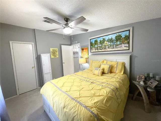 a view of a hallway to rooms