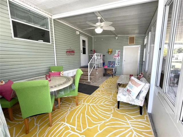 a view of a house with entertaining space and a street view