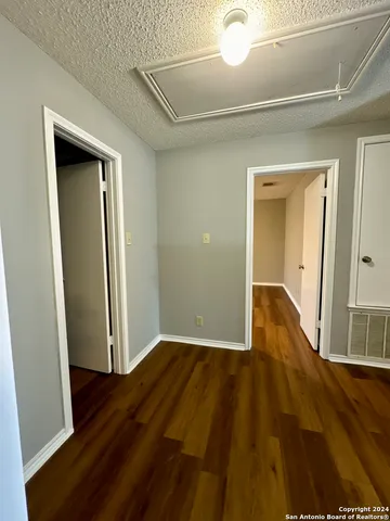 a view of a big room with wooden floor and closet