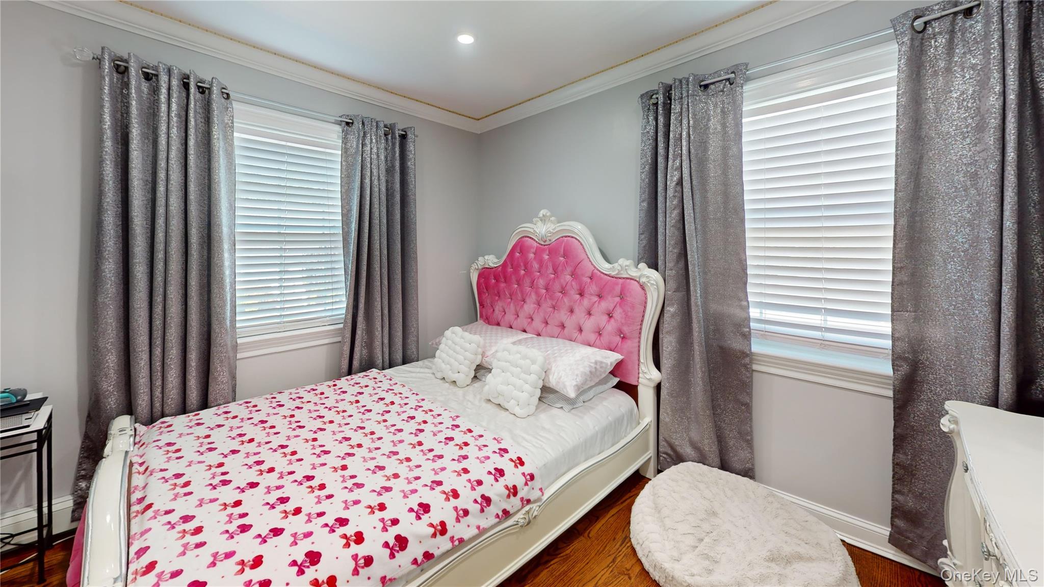 125 Spruce Street Lindenhurst, NY 11757 - Photo 15 of 29 Bedroom with crown molding, dark wood-type flooring, and baseboard heating