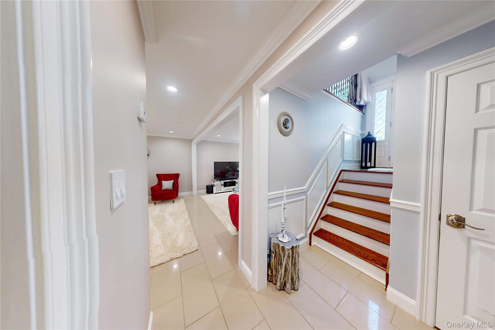 125 Spruce Street Lindenhurst, NY 11757 - Photo 18 of 29 Staircase featuring tile patterned flooring, crown molding, and recessed lighting