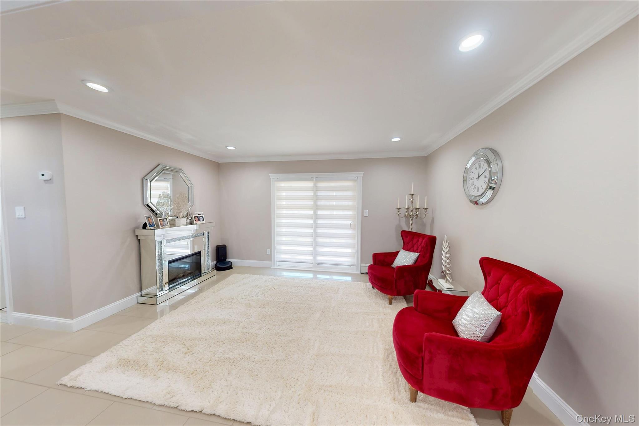 125 Spruce Street Lindenhurst, NY 11757 - Photo 19 of 29 Sitting room featuring ornamental molding, a fireplace, recessed lighting, and tile patterned flooring