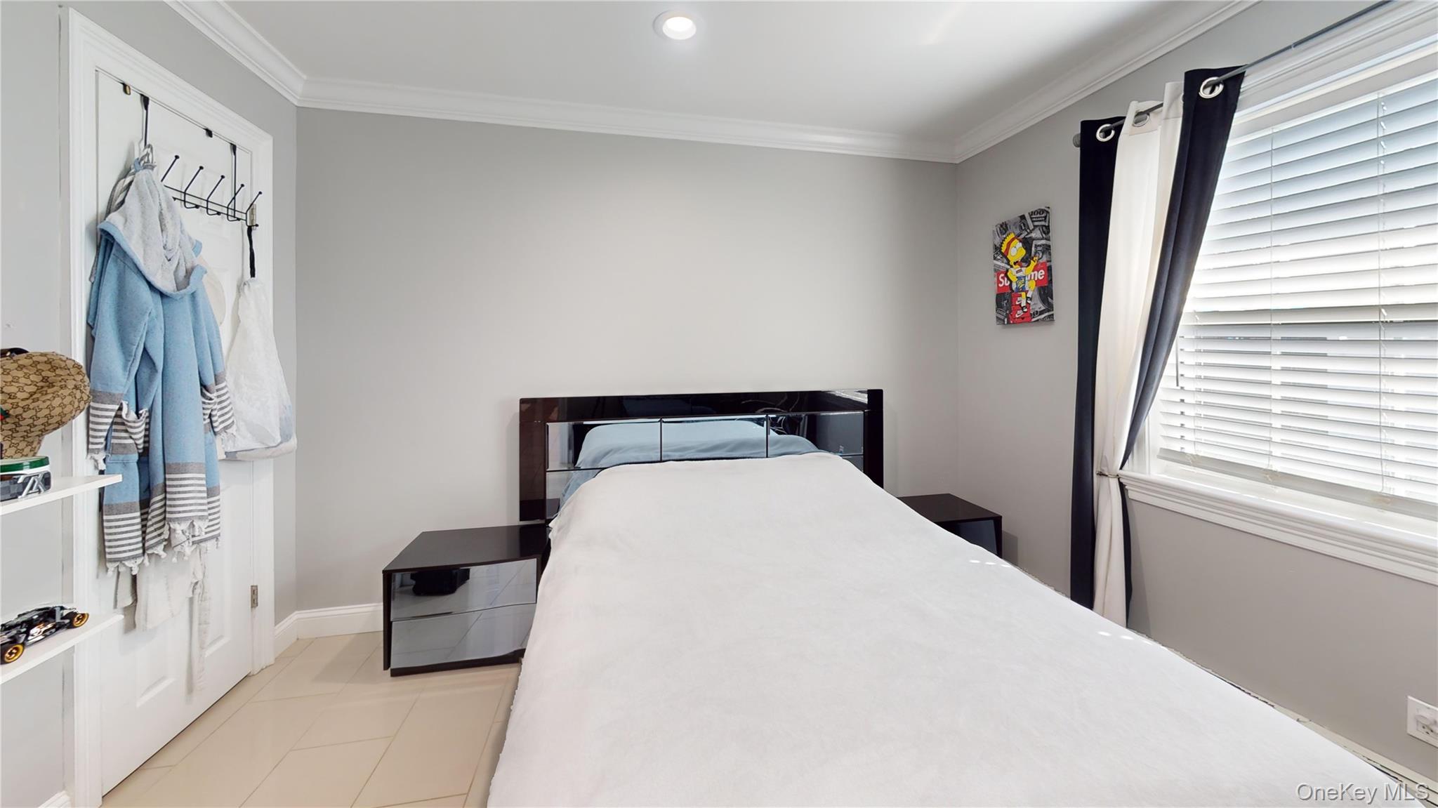 125 Spruce Street Lindenhurst, NY 11757 - Photo 24 of 29 Bedroom with light tile patterned flooring, crown molding, and recessed lighting