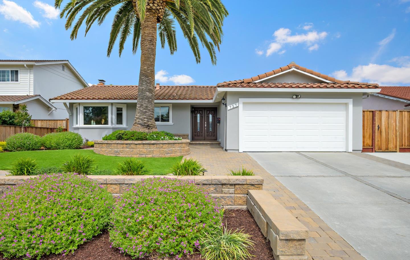 727 Liverpool Way Sunnyvale, CA 94087 - Photo 1 of 26 a front view of a house with a yard and garage