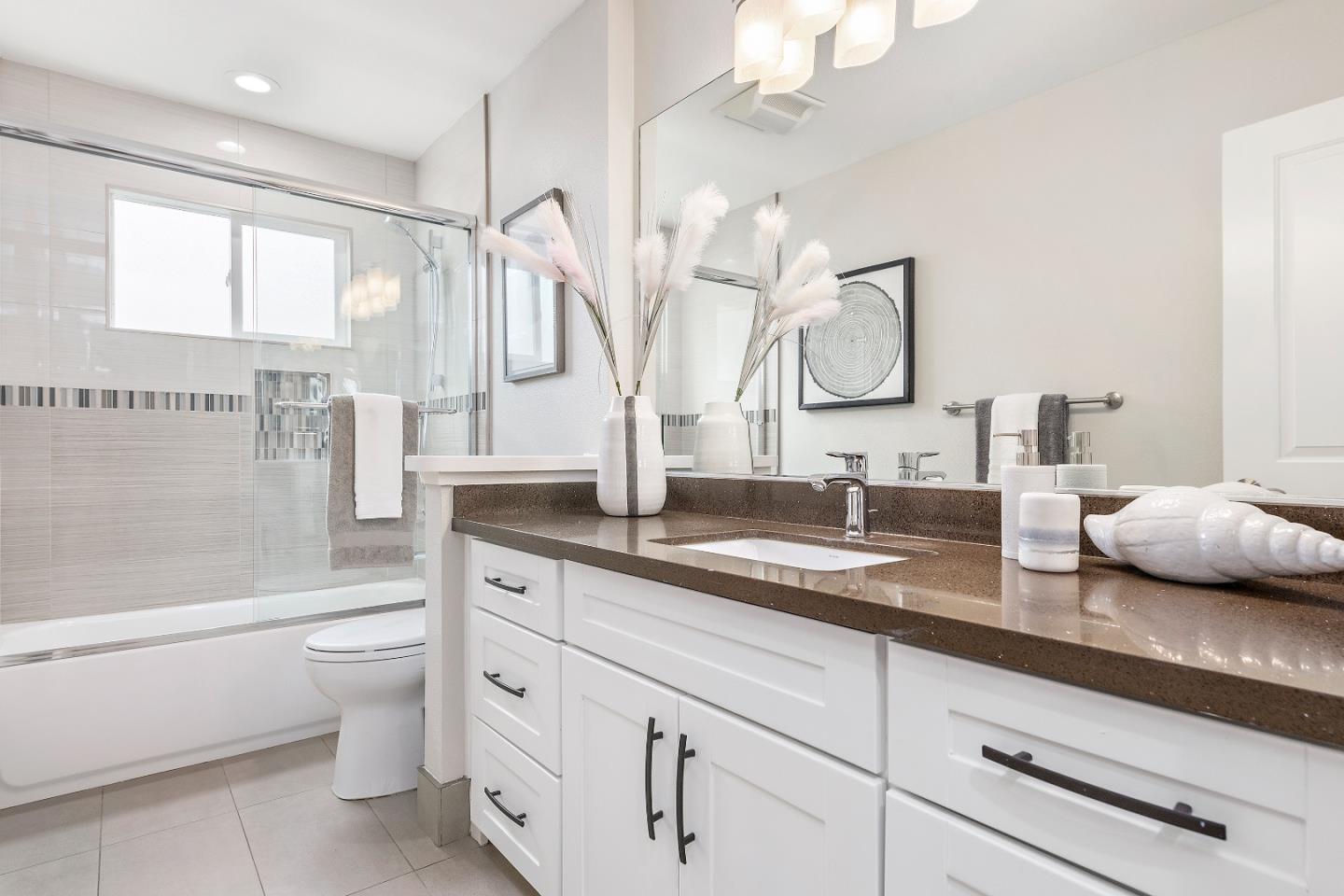 727 Liverpool Way Sunnyvale, CA 94087 - Photo 14 of 26 a bathroom with a double vanity sink mirror and toilet