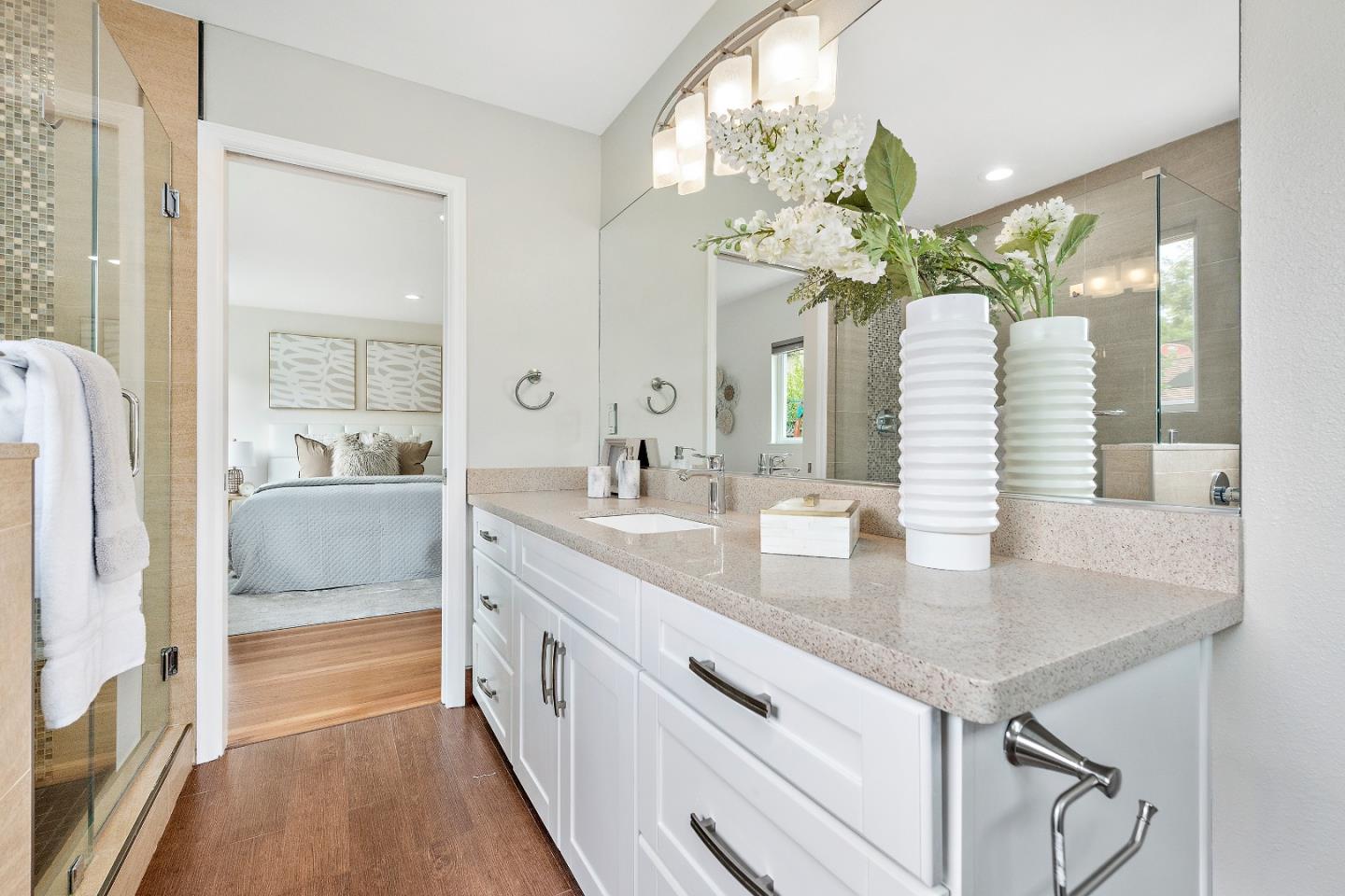727 Liverpool Way Sunnyvale, CA 94087 - Photo 20 of 26 a spacious en suite bathroom with a granite countertop double vanity and a mirror
