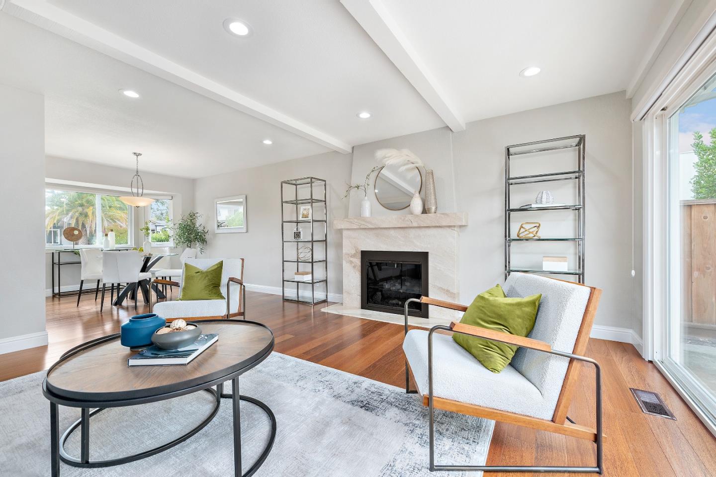 727 Liverpool Way Sunnyvale, CA 94087 - Photo 7 of 26 a living room with furniture a fireplace and a large window